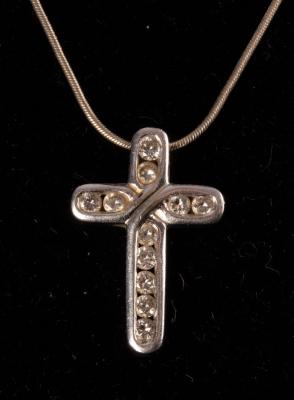 A modern diamond pendant cross  2db7c7