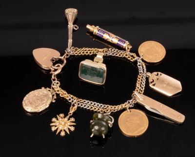 A charm bracelet with 9ct yellow