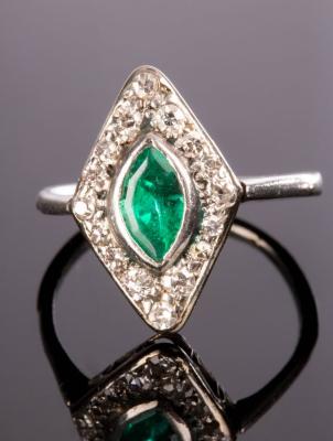 An emerald and diamond cluster