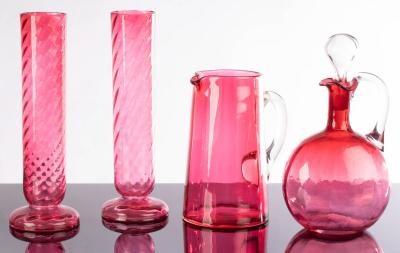 A pair of cranberry glass vases, 27cm