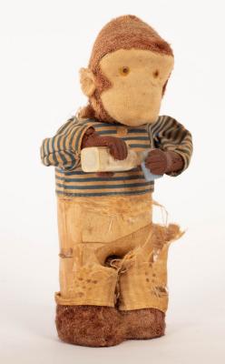 An Alps Toy Co. clockwork monkey drinking