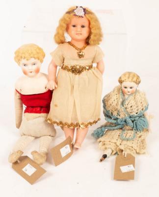 Two bisque head dolls and a wax