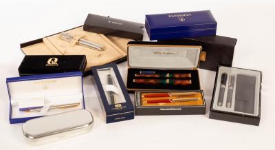 A collection of pens including Parker,