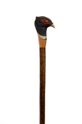 A walking stick with cock pheasant