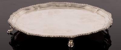 A silver salver, London 1930, with wavy