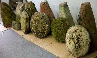 Six staddle stones with tapered bases,