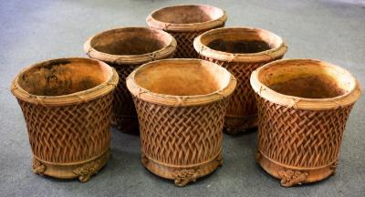 Six terracotta lattice pots, 52cm high