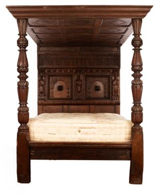 A four-poster bed of 17th Century style,