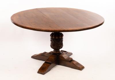An oak centre table on carved column