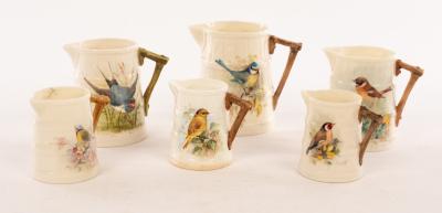 Six Royal Worcester ribbed jugs,