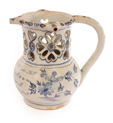 An English Delftware puzzle jug inscribed