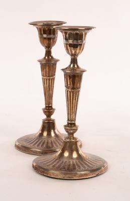 A pair of silver candlesticks, HE &