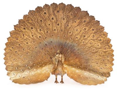 A silver gilt figure of a peacock,