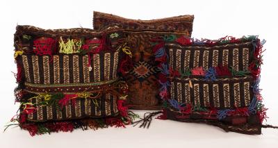 Three vintage Afghan saddlebag cushions