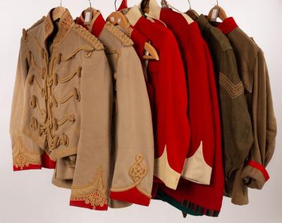 A collection of military uniforms, jackets,