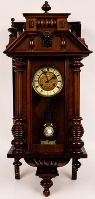 A Vienna type wall clock in a walnut