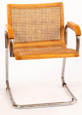 An Italian cantilever chair with caned