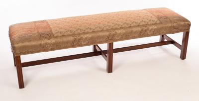 A pair of upholstered long bench seats,