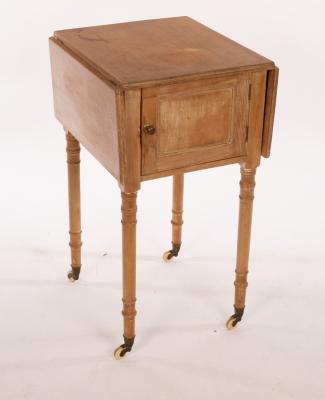 A pine two-flap bedside cupboard