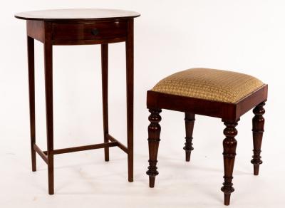 An oval mahogany side table, fitted