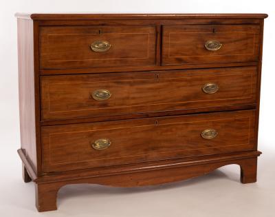 A mahogany chest of two long and