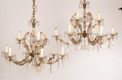 A pair of glass nine-light chandeliers