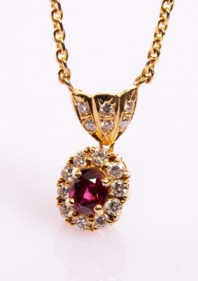 A ruby and diamond cluster pendant