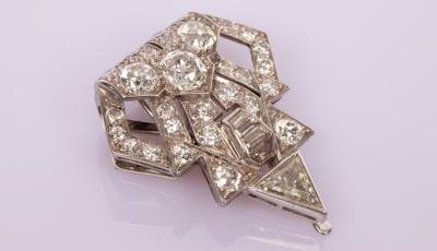 An Art Deco diamond clip of stylised