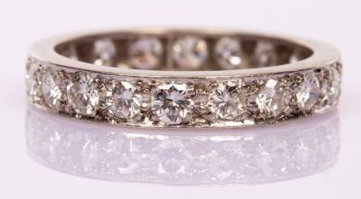 A diamond eternity ring set with twenty