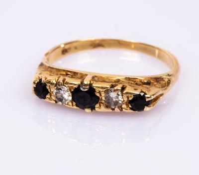 A sapphire and diamond five-stone