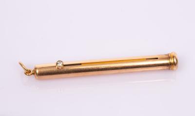 A gold propelling pencil by The Goldsmiths