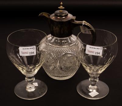 A pair of wine glasses with thumb