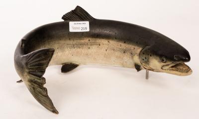 A ceramic figure of a trout by