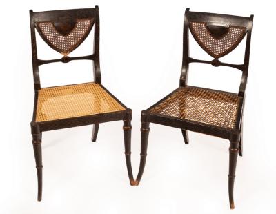 A pair of Regency ebonised single