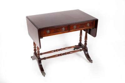 A mahogany two-flap sofa table fitted
