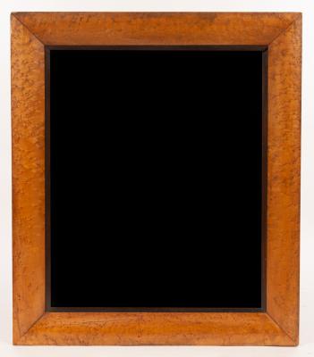 A rectangular wall mirror with bevelled