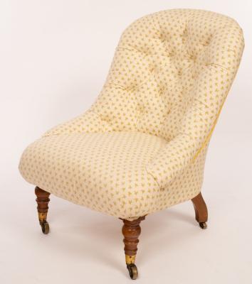 A Victorian upholstered chair with deep