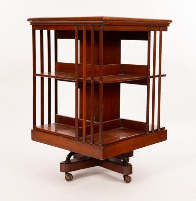 An Edwardian walnut revolving bookcase