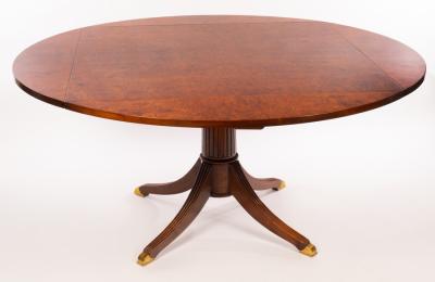 A burr walnut square, four flap dining