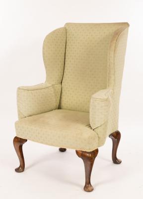 A Queen Anne style wing armchair with