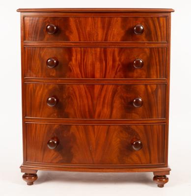 A mahogany bowfront chest of four long