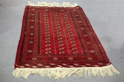 A Turkoman rug, the red field with