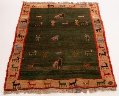 A Persian Gabbeh rug, central dark