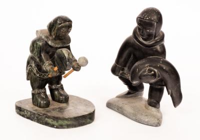 Two carved slate figures of Eskimos,