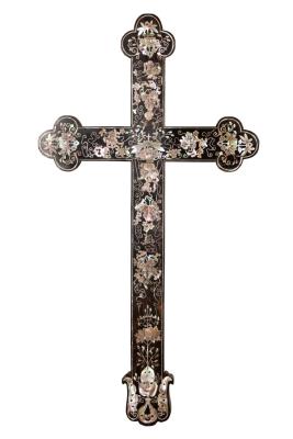 An ebony and abalone inlaid cross, perhaps