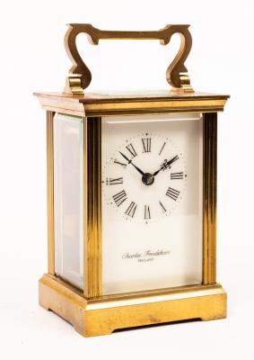A gilt brass carriage clock by Devon