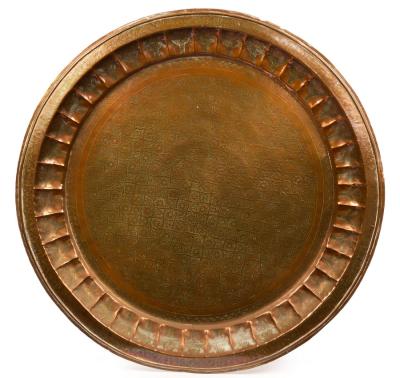 A Turkish beaten copper charger, 97cm