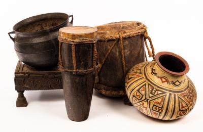 Two tribal drums, a low stool, a cauldron