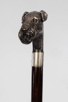 A walking stick, the head modelled as