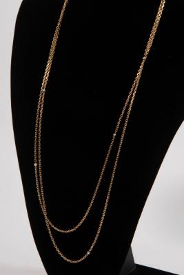 A gold guard chain, tests as 18ct gold,